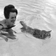 Illustration for article titled Heres a Lady Taking Her Cat for a Swim
